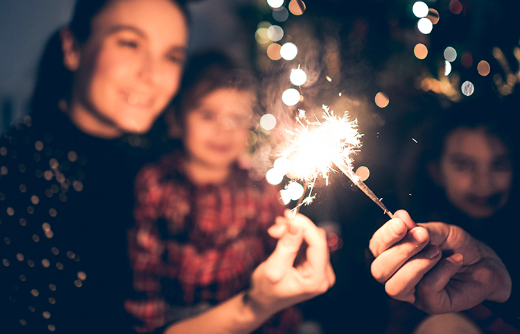 Group of people celebrating on New Years Eve with sparklers