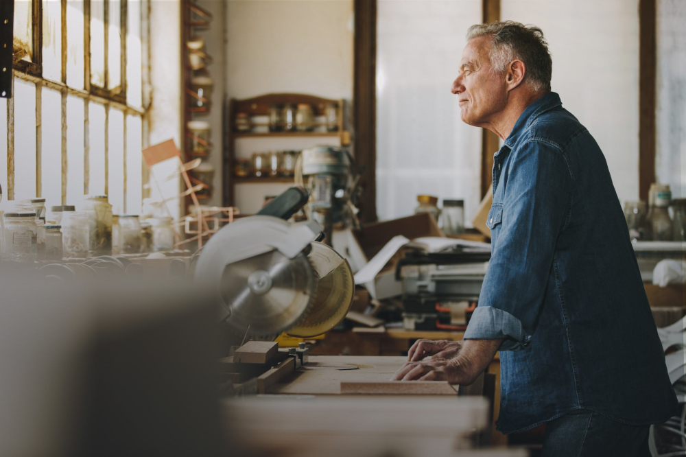 Mature man in woodshop